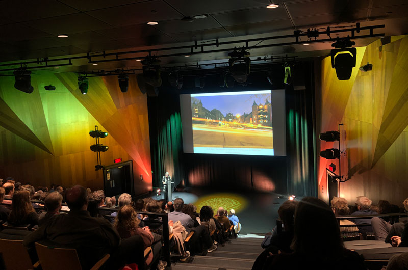 audience watches talk in auditorium