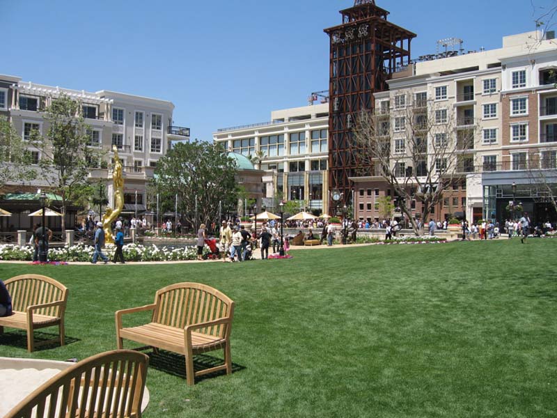 view of the green with multi-story buildings