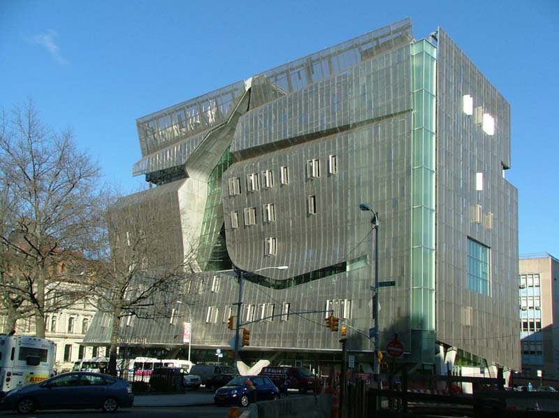 semi-transparent multi-story glass and steel building