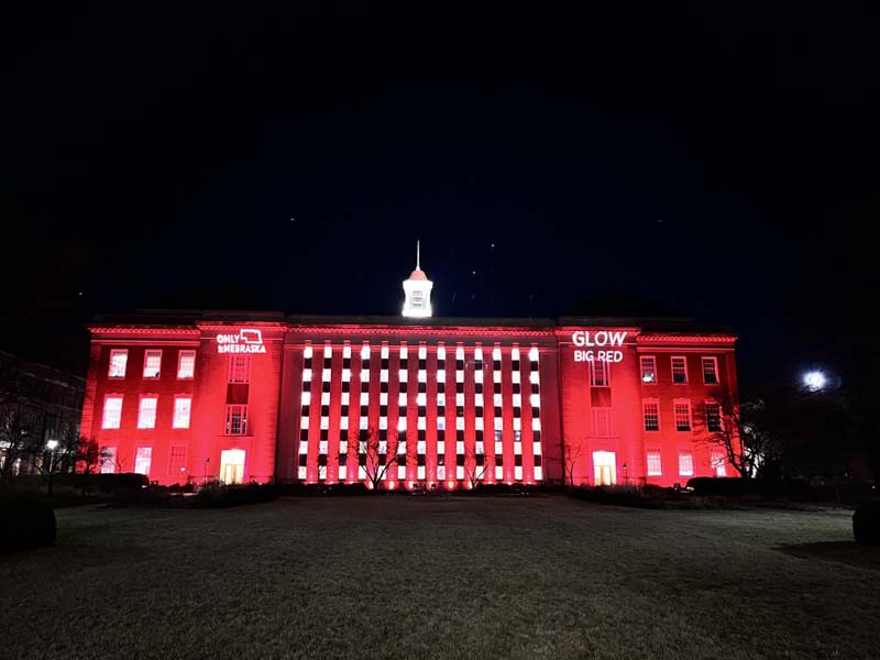 building lit up with red lights at night