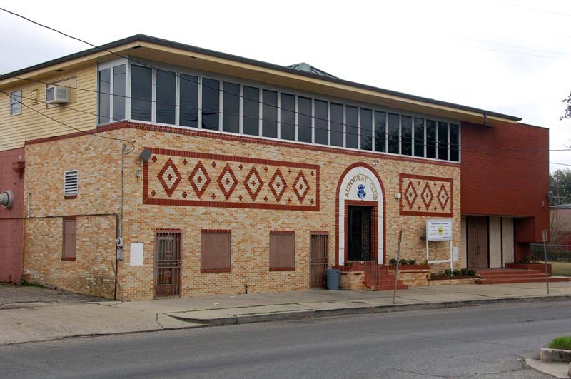 brick building with windows along roofline