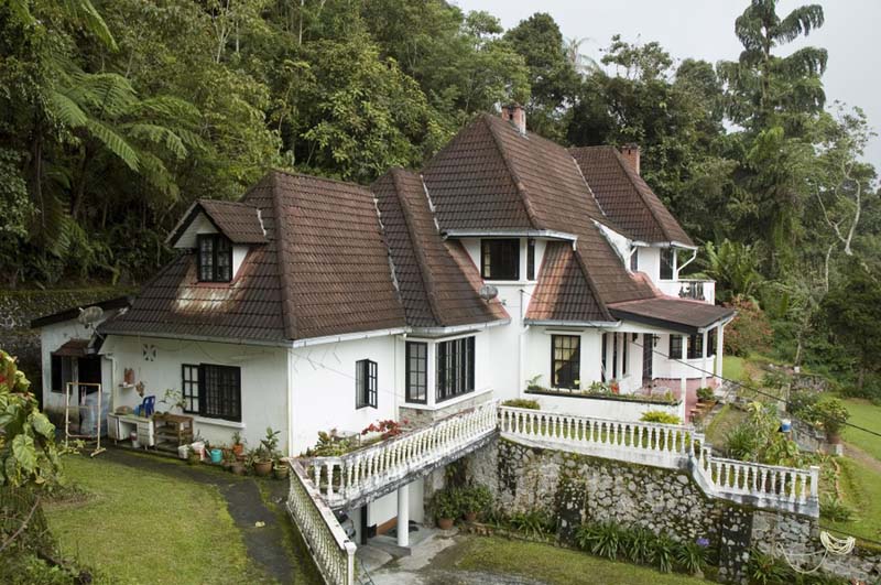 white multi-level building with brown gable roof