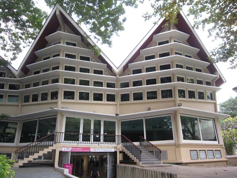 angular building with lots of windows and gabled roof